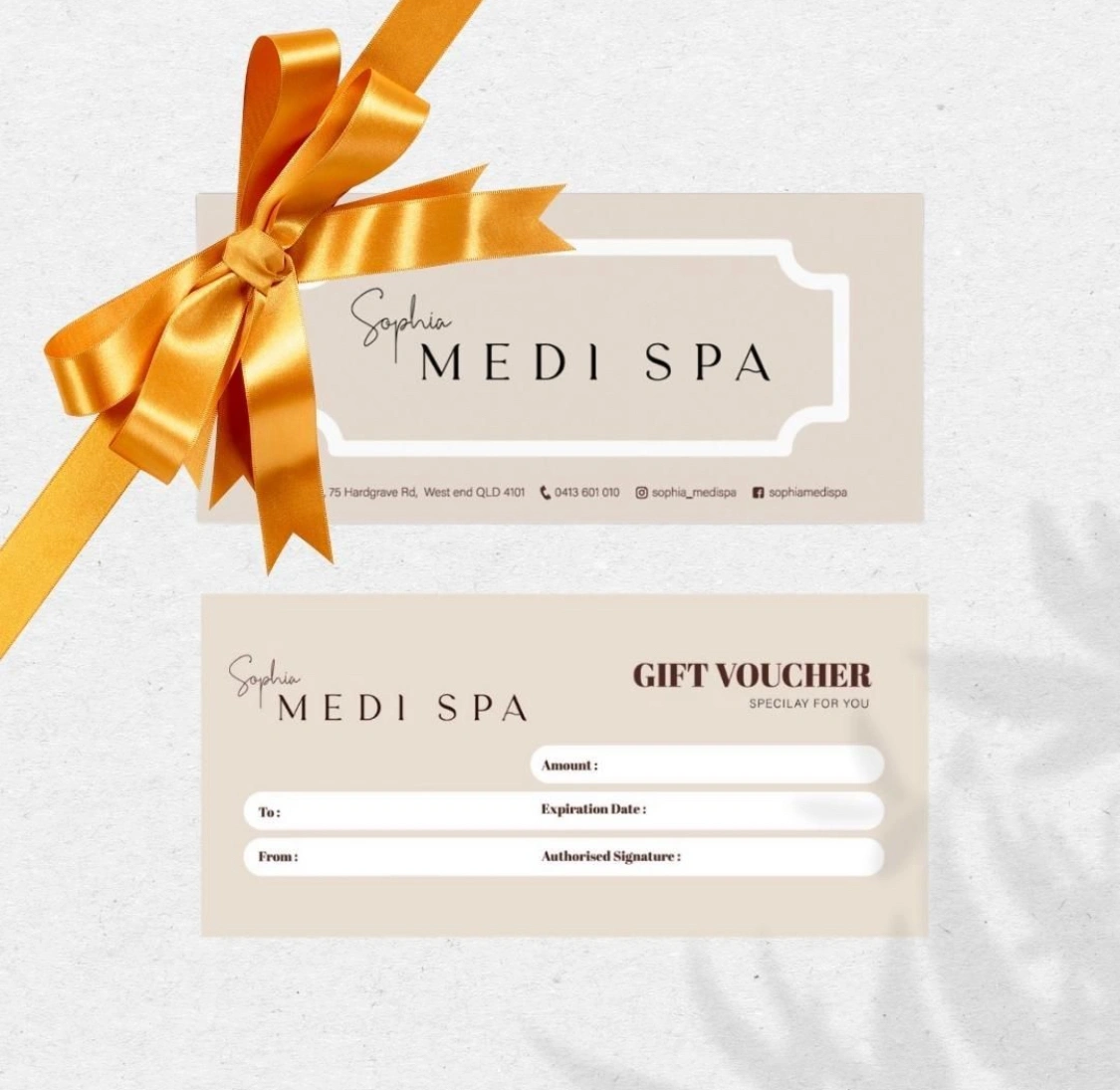 Sophia Medi Spa gift voucher wrapped with a gold ribbon